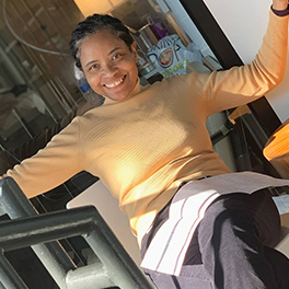 Photo of AIM Member Helene McKoy sitting back while smiling