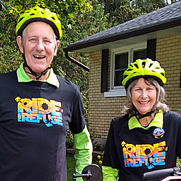 Photo of AIM Members Darlene and Kees Vandermey wearing bike helmets before a bike ride
