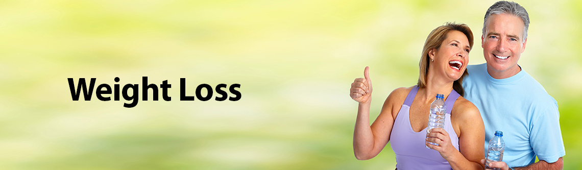 Fit couple holding water with thumbs up